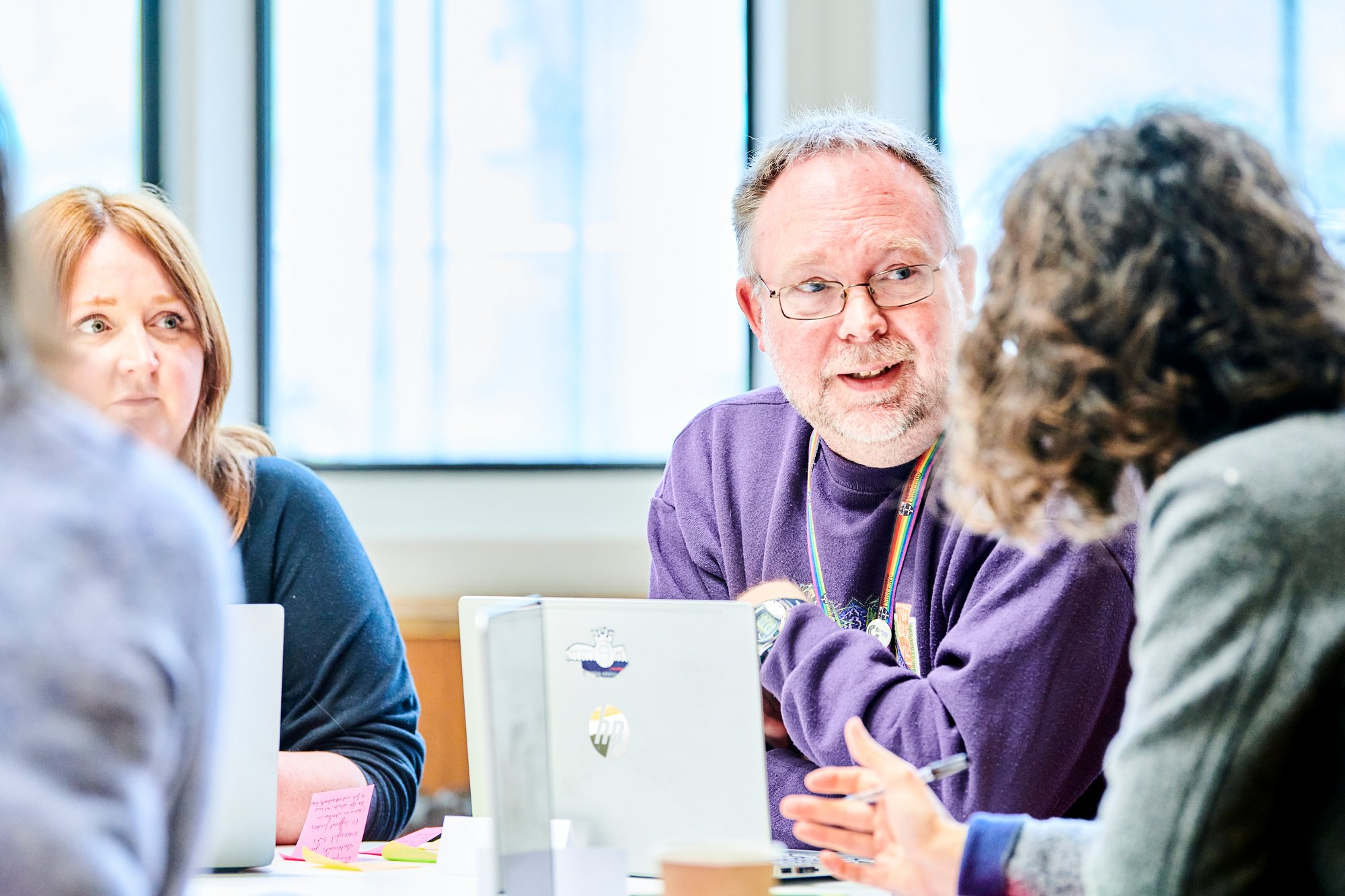 A group chatting together while attending the Equality, Diversity, and Inclusion workshop.